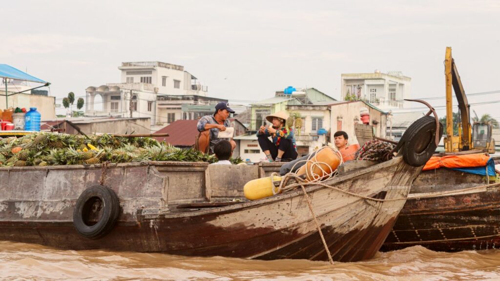 Floating market sellers at Cai Rang, Mekong Delta.