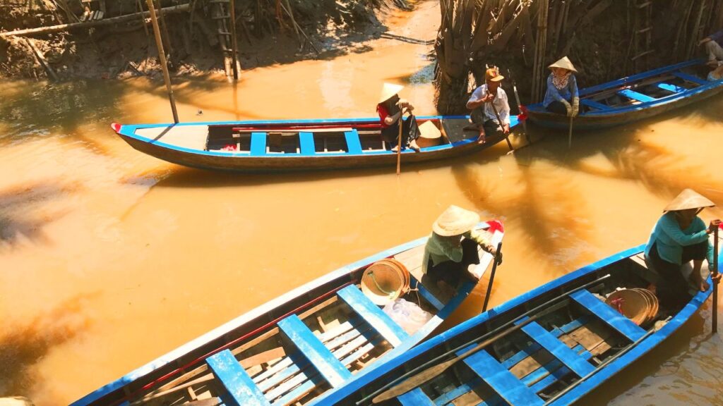 Sampans meeting on the Mekong River.