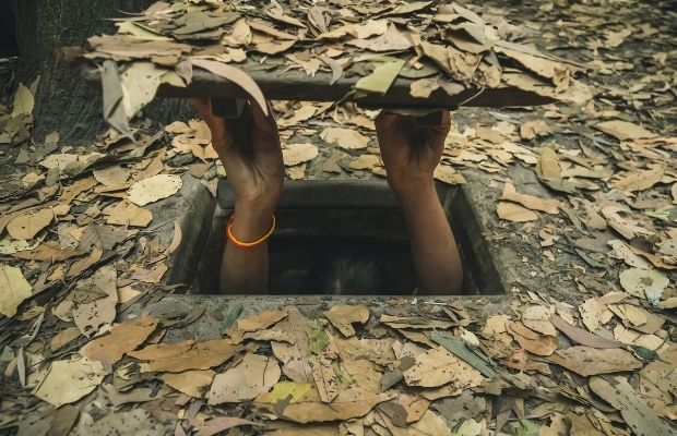 Person emerging from Cu Chi Tunnels