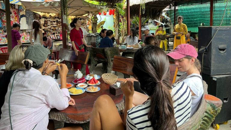 Travelers having lunch in the Mekong Delta