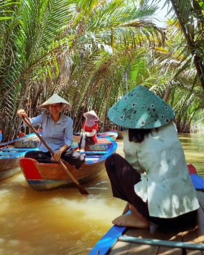 Travelers on a canal in the Mekong Delta