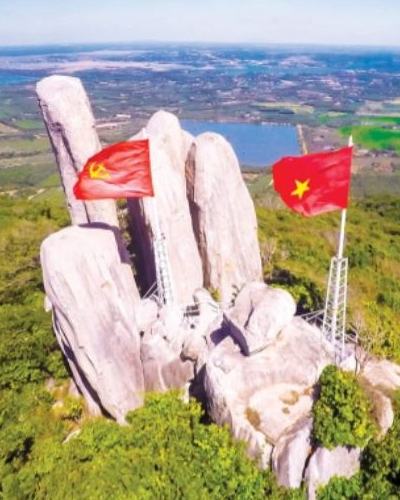 Vietnam flags atop Minh Dam Mountain