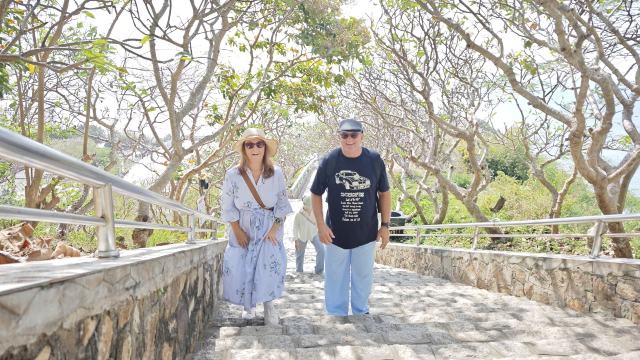 Tour guests climbing the steps to Jesus in Vung Tau